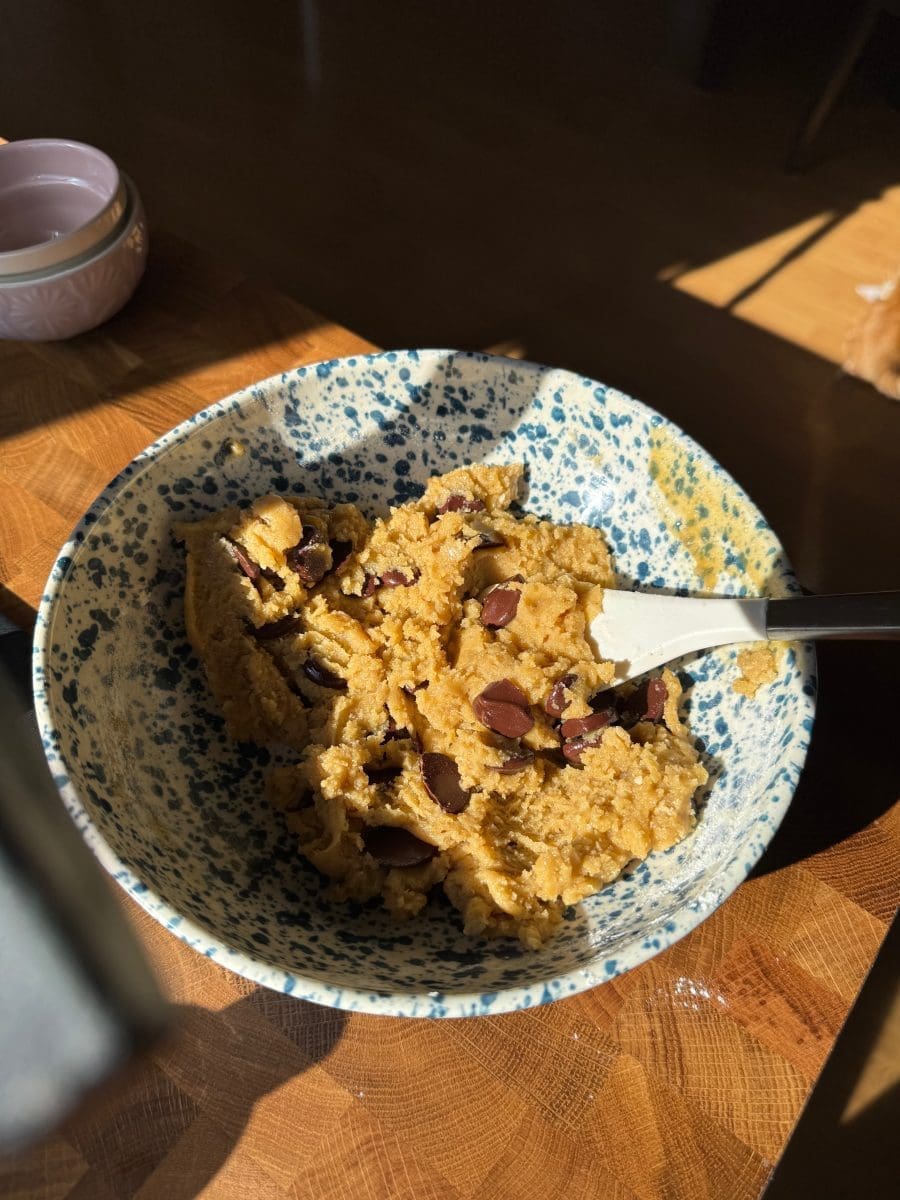 The finished cookie dough in a mixing bowl.