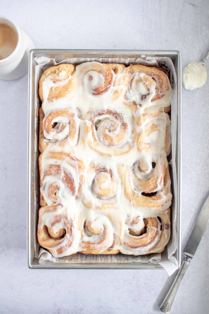 An overhead shot of the cinnamon rolls surrounded by decorations