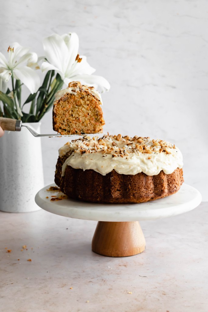 revealing a slice of the toasted carrot bundt cake