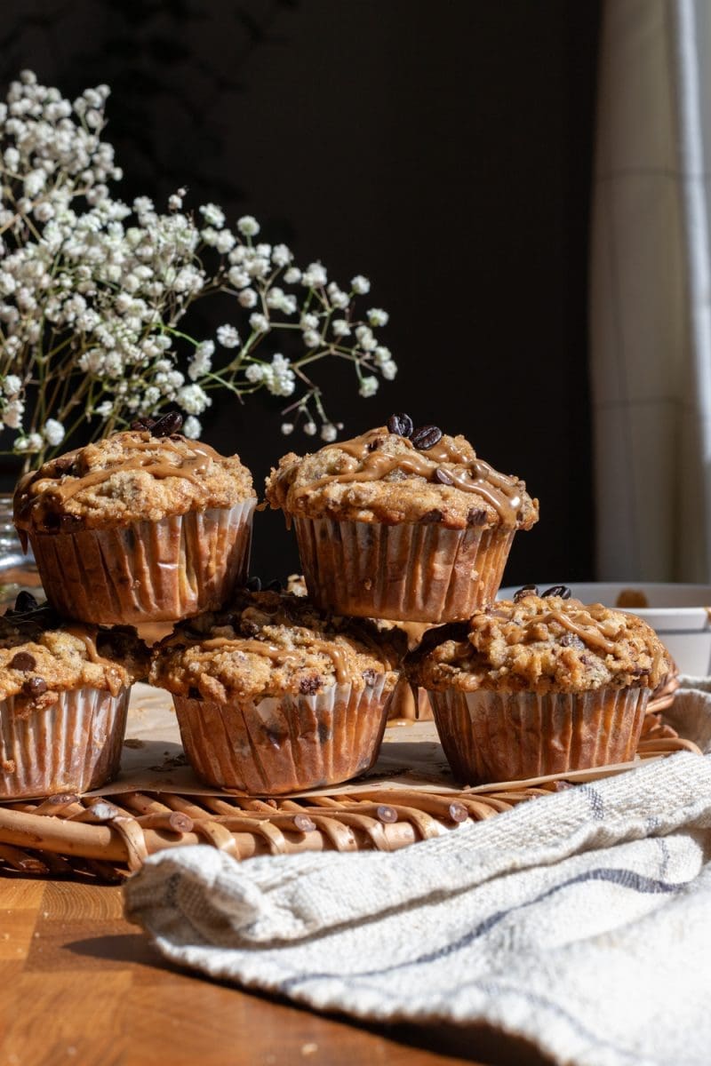 Small batch mocha muffins stacked on top of each other.