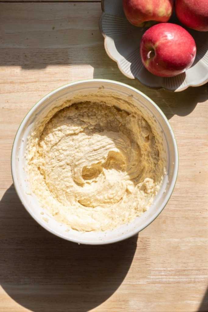 The cake batter after beating together the sugar, butter, and eggs.