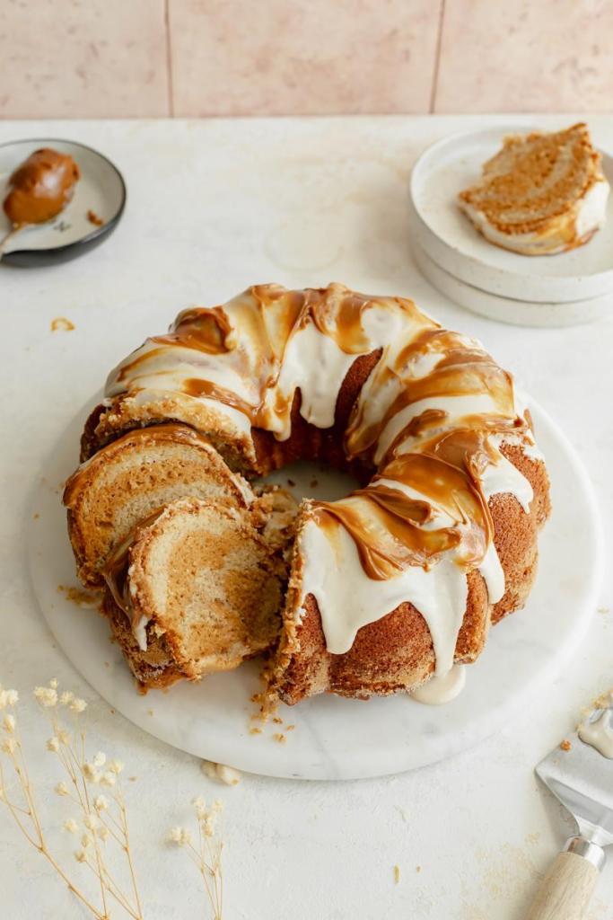 apple cider marbled bundt with two slices cut to show the marbled layers