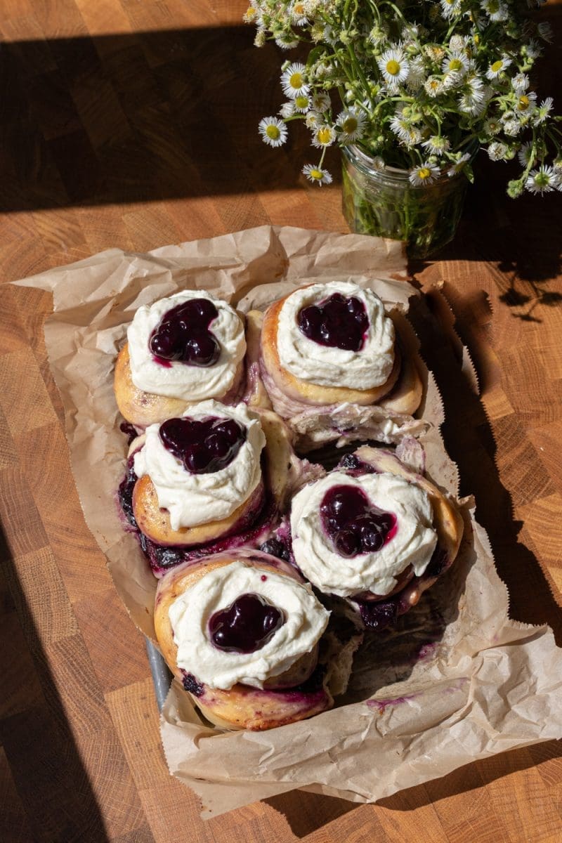 Overlooking the tray of milk bread blueberry sweet rolls.