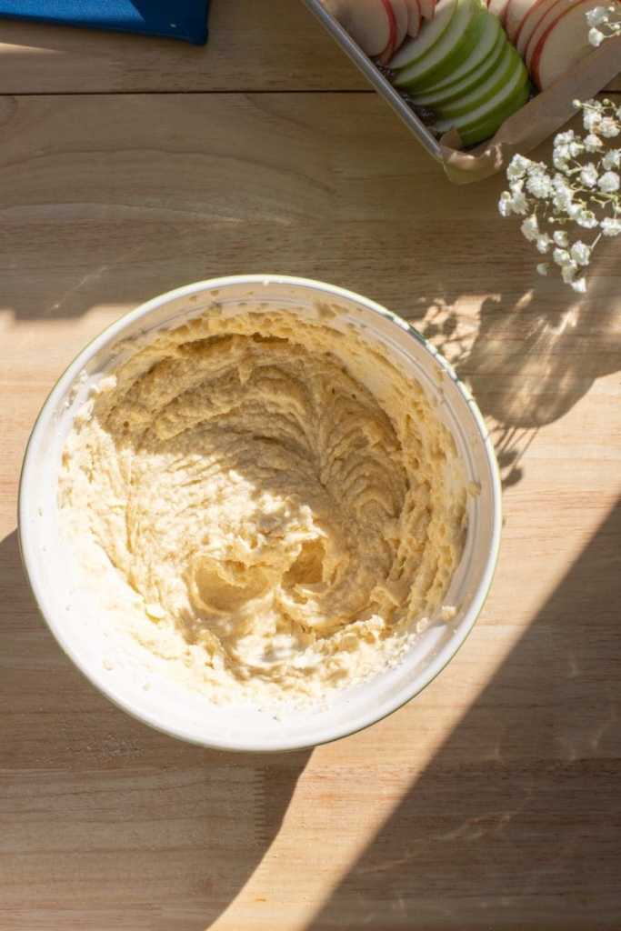 The butter, sugar, and eggs beaten together in a mixing bowl.