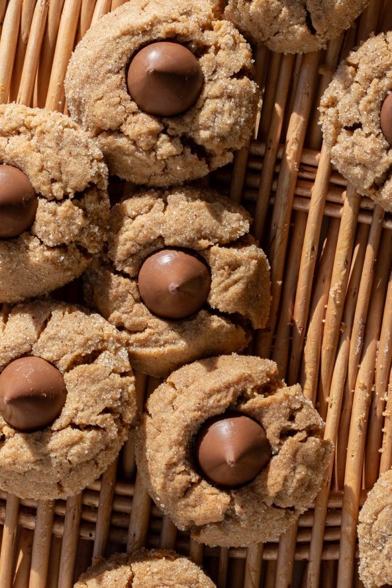 Close up of the small batch peanut butter blossoms stacked on each other.