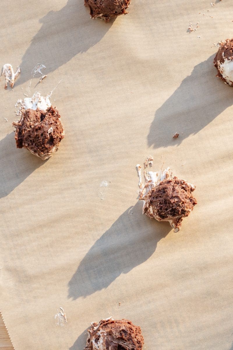 The cookie dough scooped out on a baking tray.
