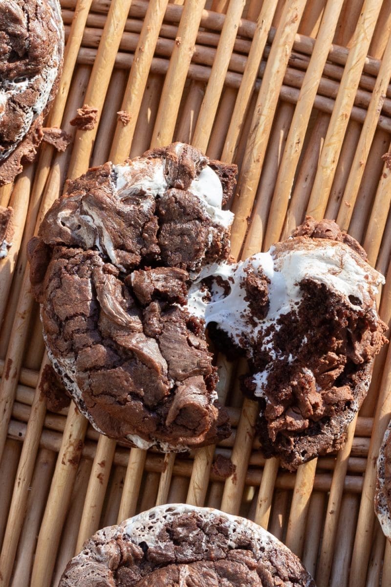 One of the hot chocolate brownie cookies being torn apart.