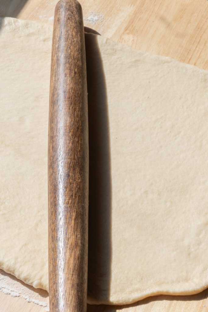 Rolling out the cinnamon roll dough.