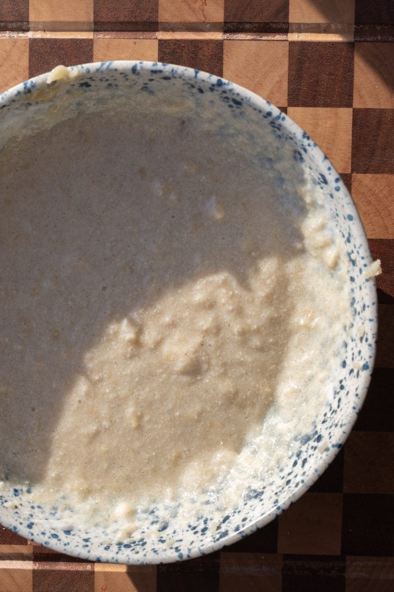 The wet ingredients beaten together in a mixing bowl.