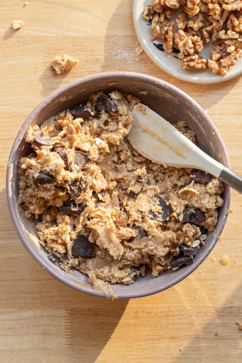 The finished banana bread cookie dough in a mixing bowl.