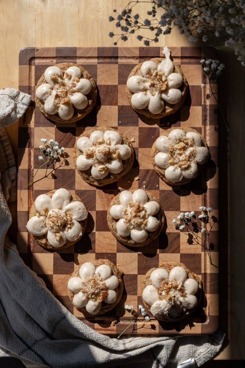 Carrot cake cookies spread out on a serving tray.