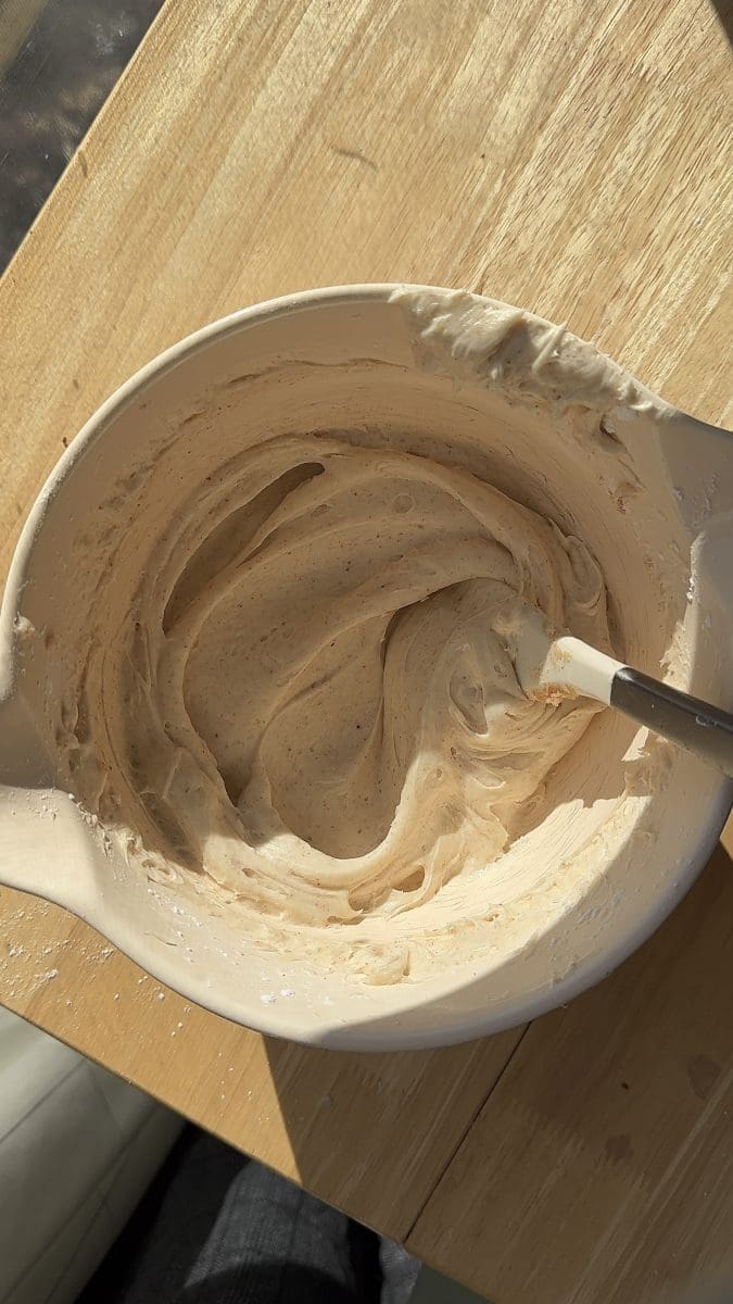 Cream cheese frosting in a mixing bowl.