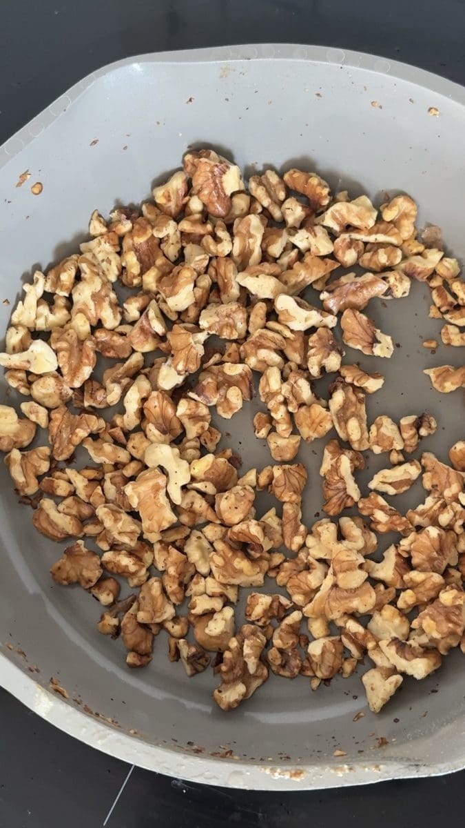 Walnuts in a saucepan on the stove.