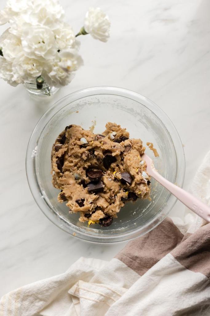 The finished cookie dough in a glass bowl.