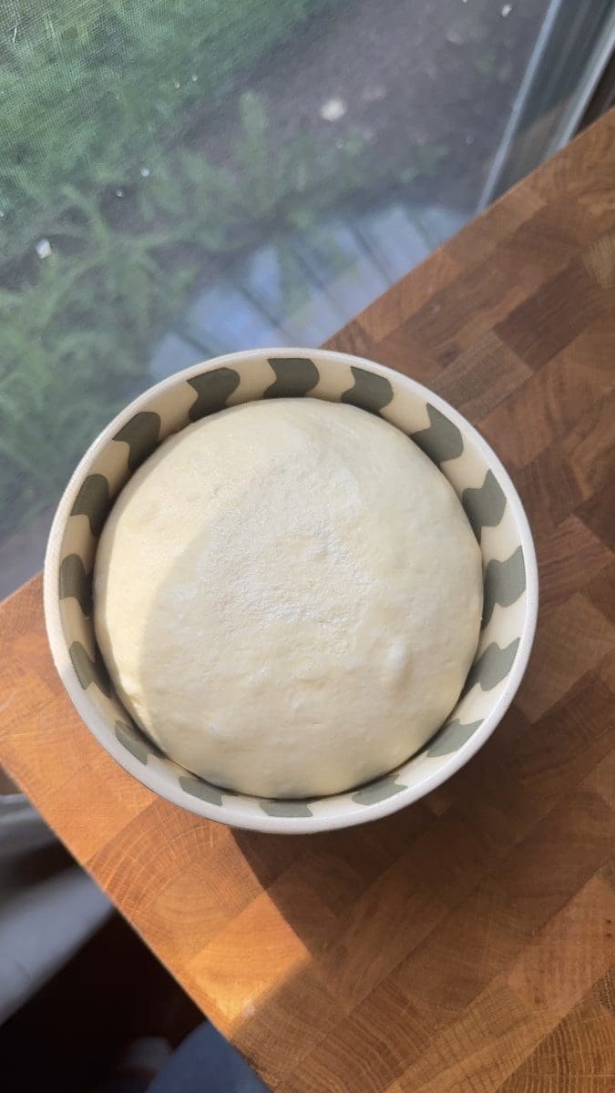 The brioche dough in a bowl.