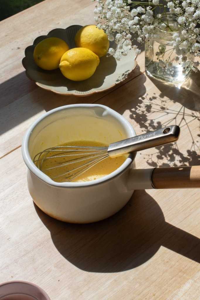The egg, lemon & sugar whisked together in a saucepan.