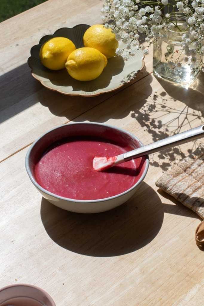 The raspberry curd in a small mixing bowl.