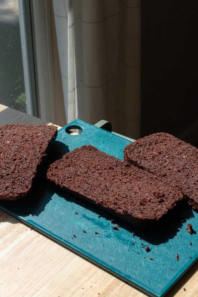 The chocolate loaf cake sliced into 3 pieces, horizontally.