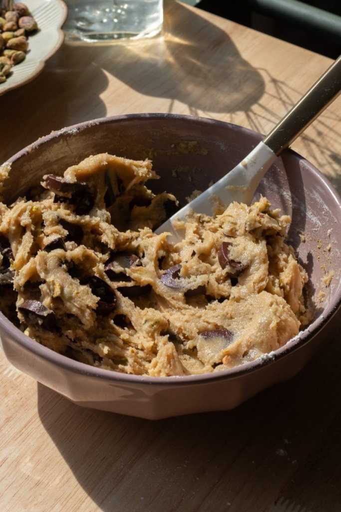 The finished cookie dough in a mixing bowl.