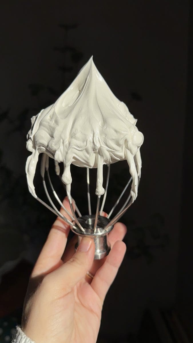 Swiss meringue on a whisk.