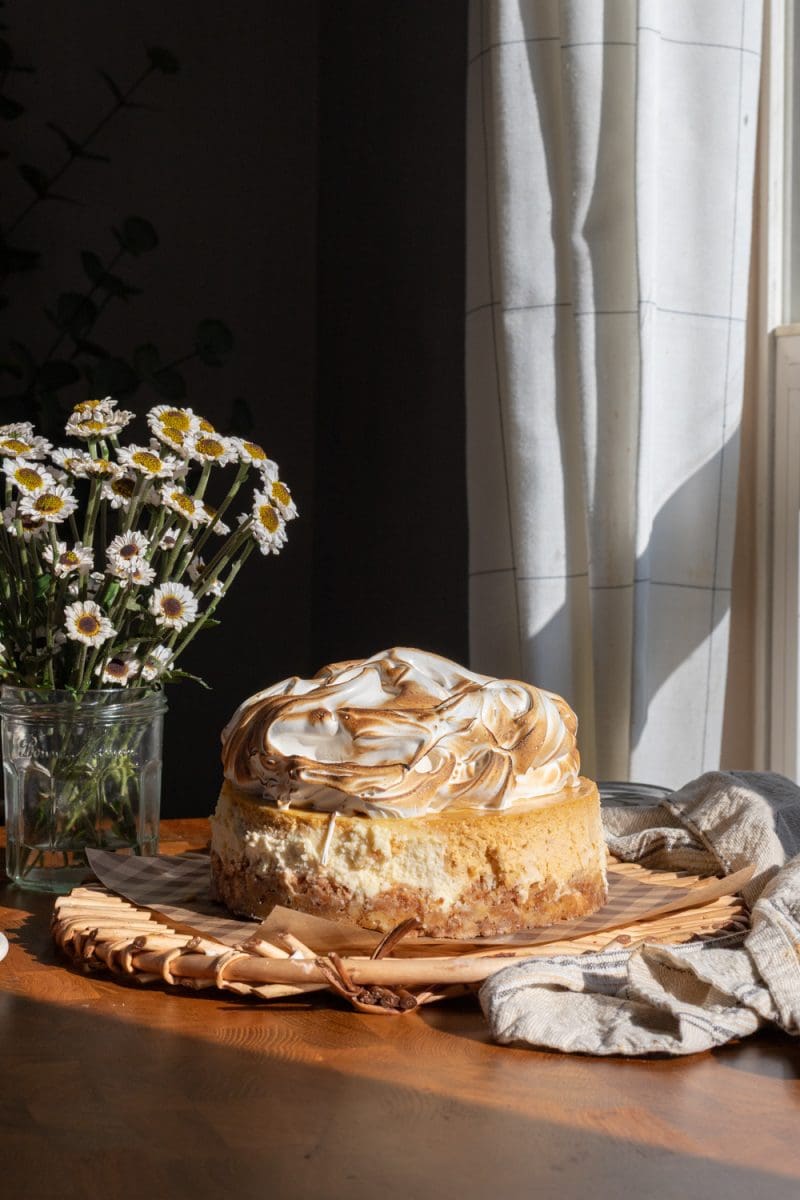 The pumpkin swirl cheesecake on a serving tray.