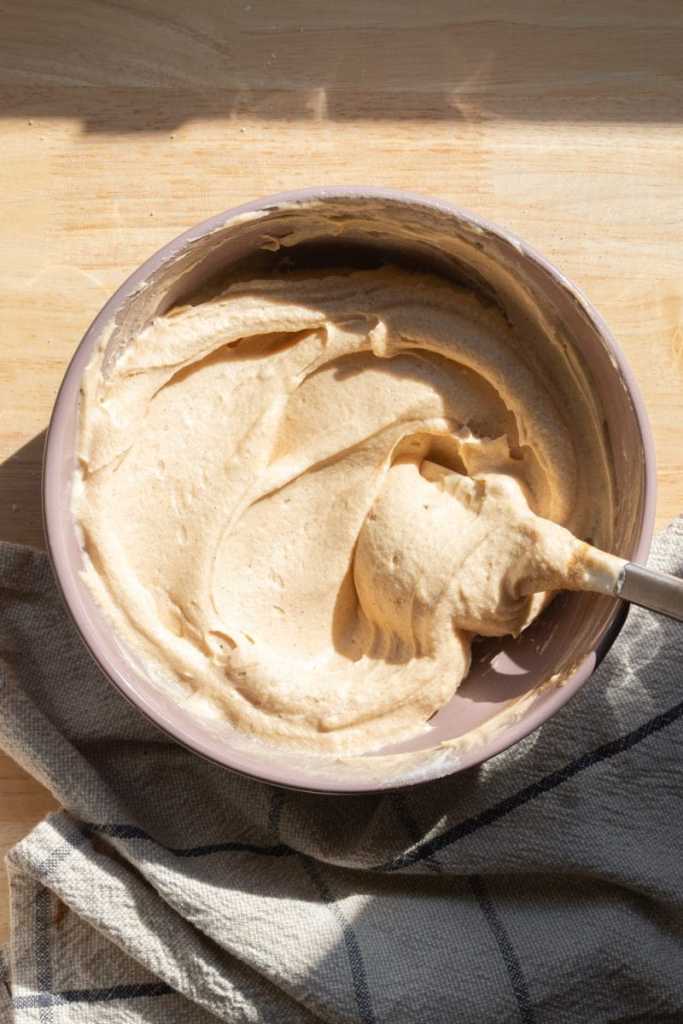 The dulce de leche buttercream in a mixing bowl.
