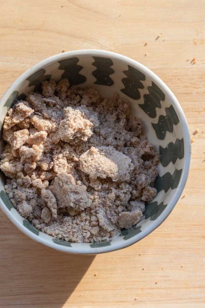The streusel in a mixing bowl.