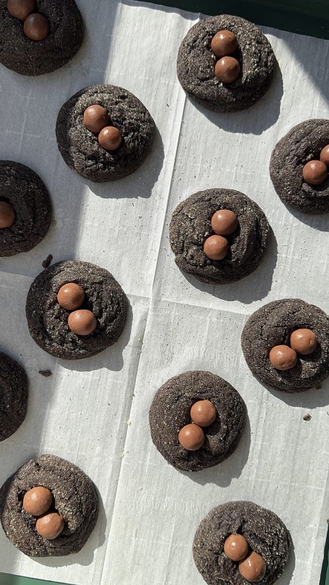 The cookies with whoppers pressed into them after baking.