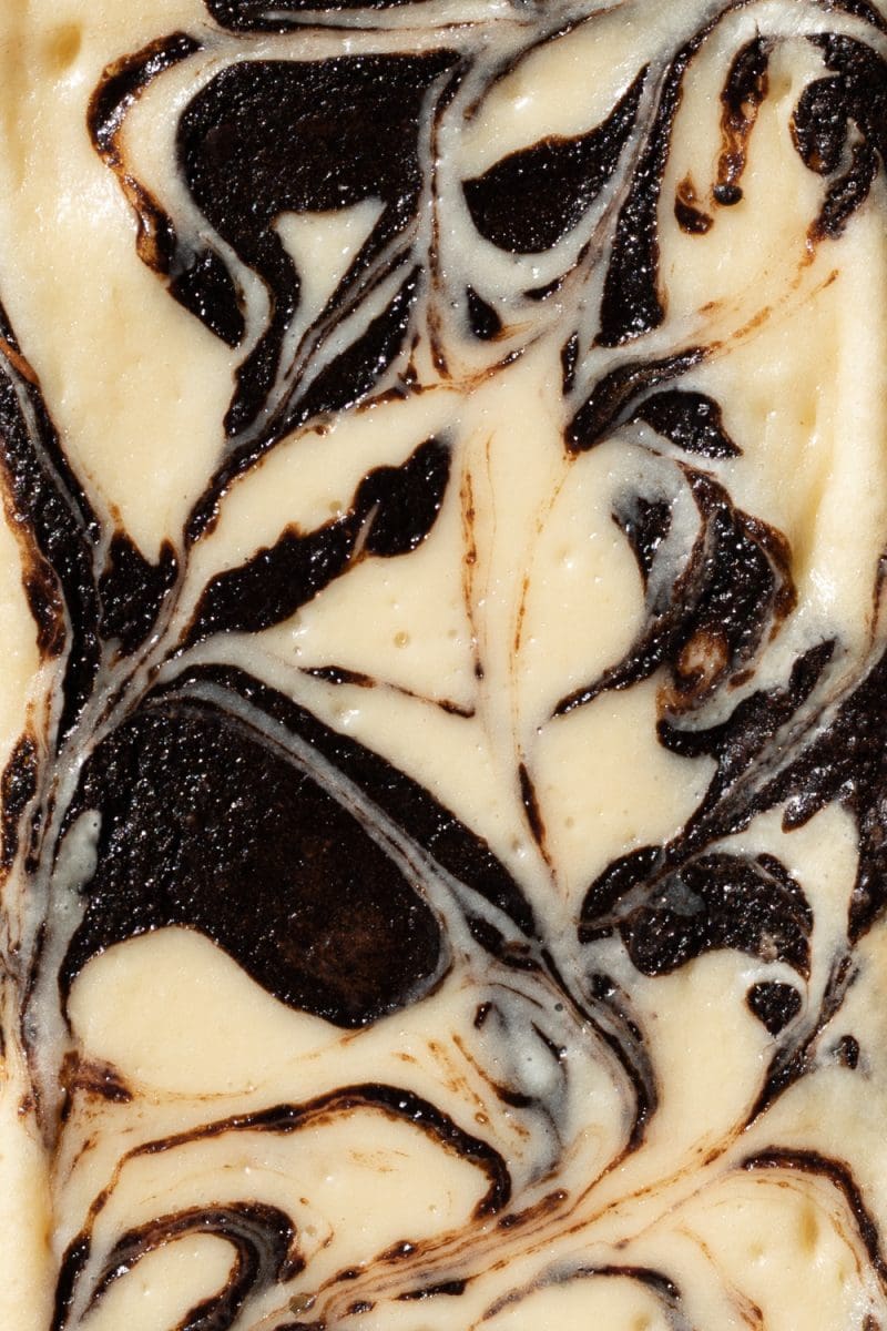 The top of the dark chocolate cheesecake brownies.