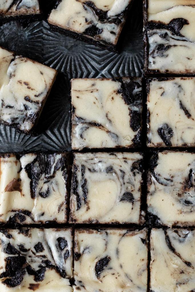 flat lay of the dark chocolate cheesecake brownies on a tray