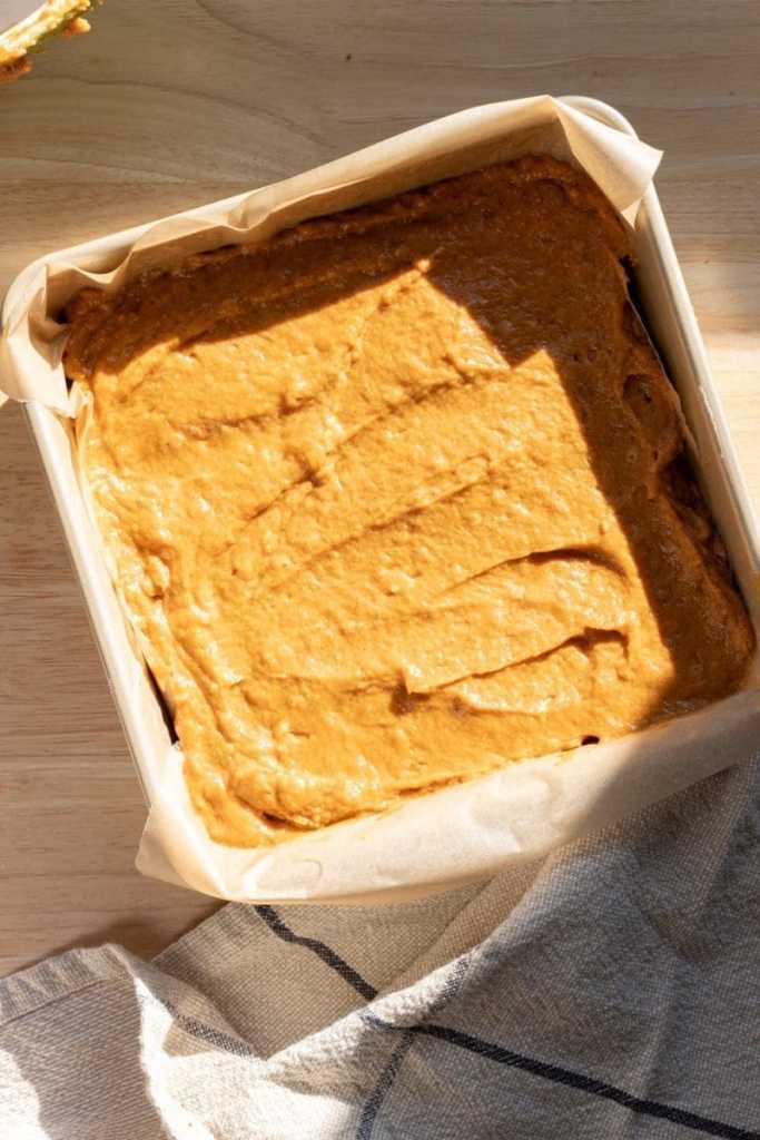 The pumpkin spice cake batter in the pan, prior to baking.