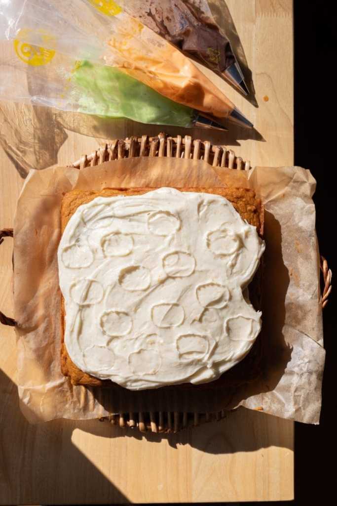 The cake with mini pumpkin outlines in the frosting.