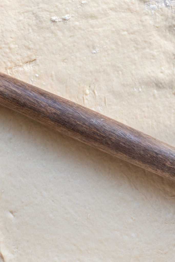 Rolling out the dough.