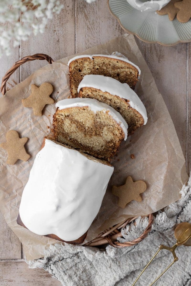 Slices of marbled gingerbread pound cake next to the whole loaf.