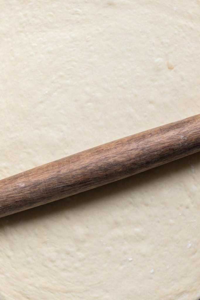 Rolling out the dough.