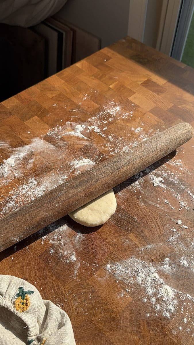 Rolling out the dough balls.