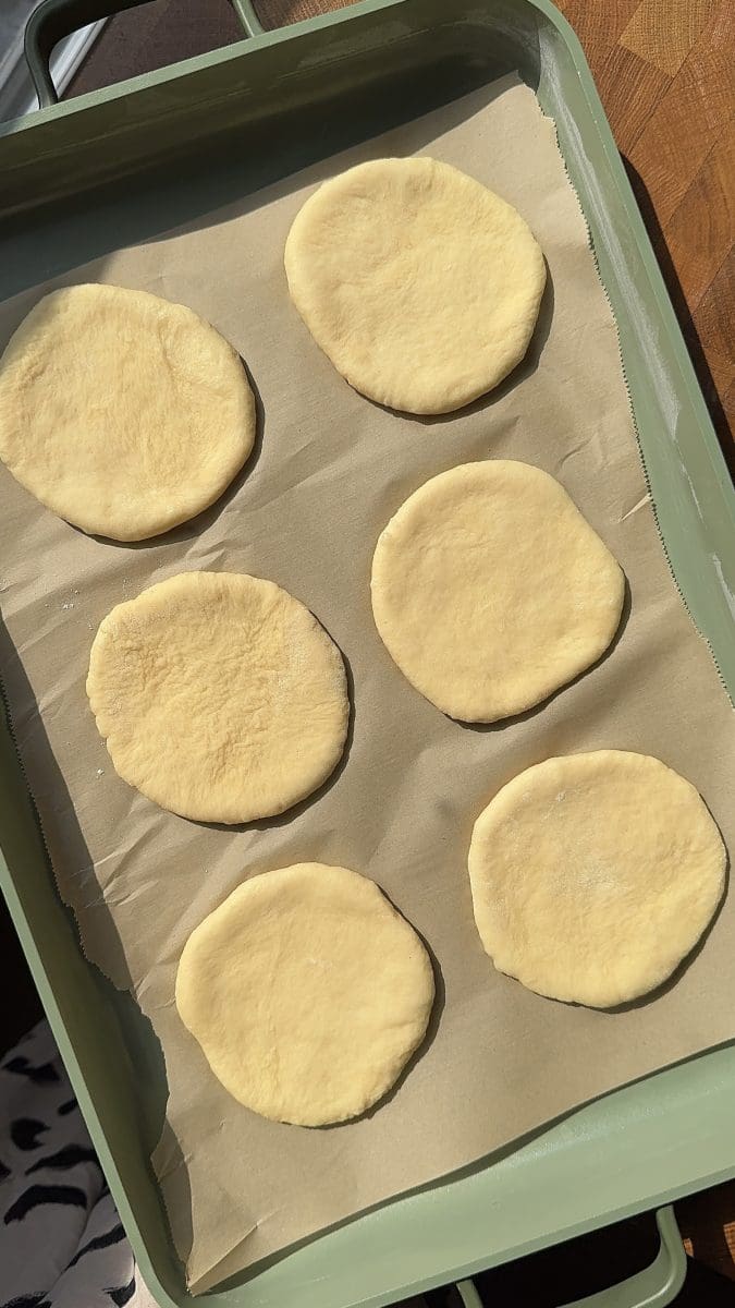The rolled out pastries on a baking tray.