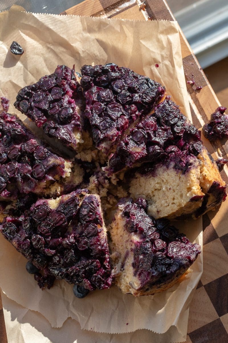 Overhead view of the banana blueberry upside down cake, sliced.