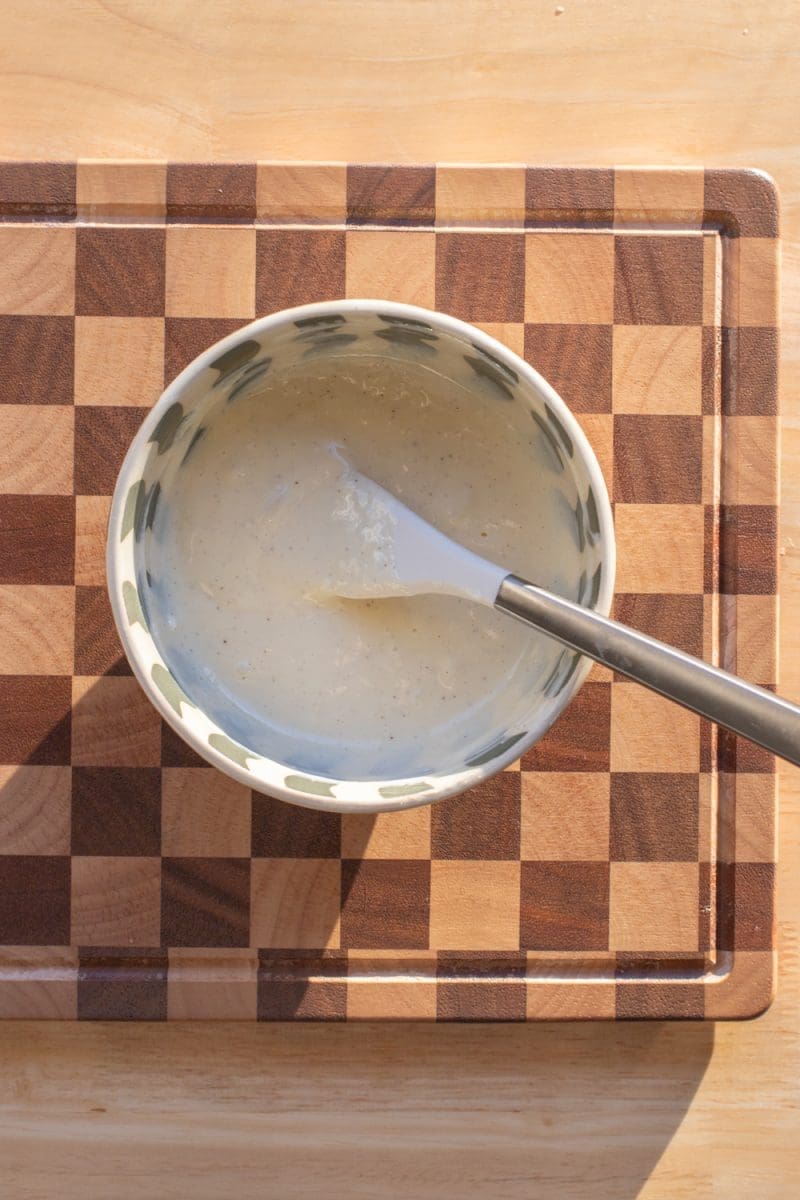 The cheesecake batter in a small mixing bowl.