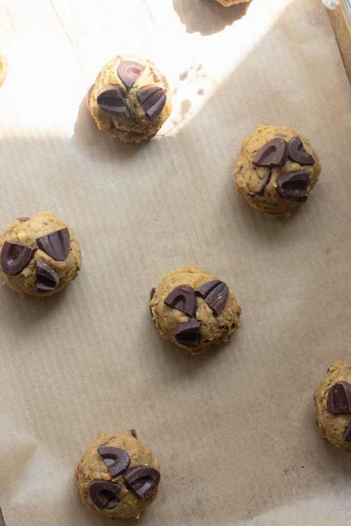 The cookie dough portioned out on a cookie sheet.