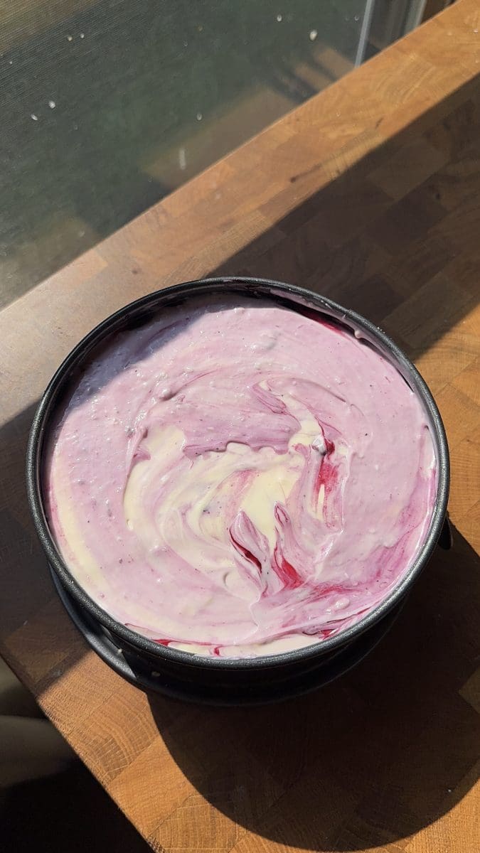 The wild blueberry cheesecake in a pan, before baking.