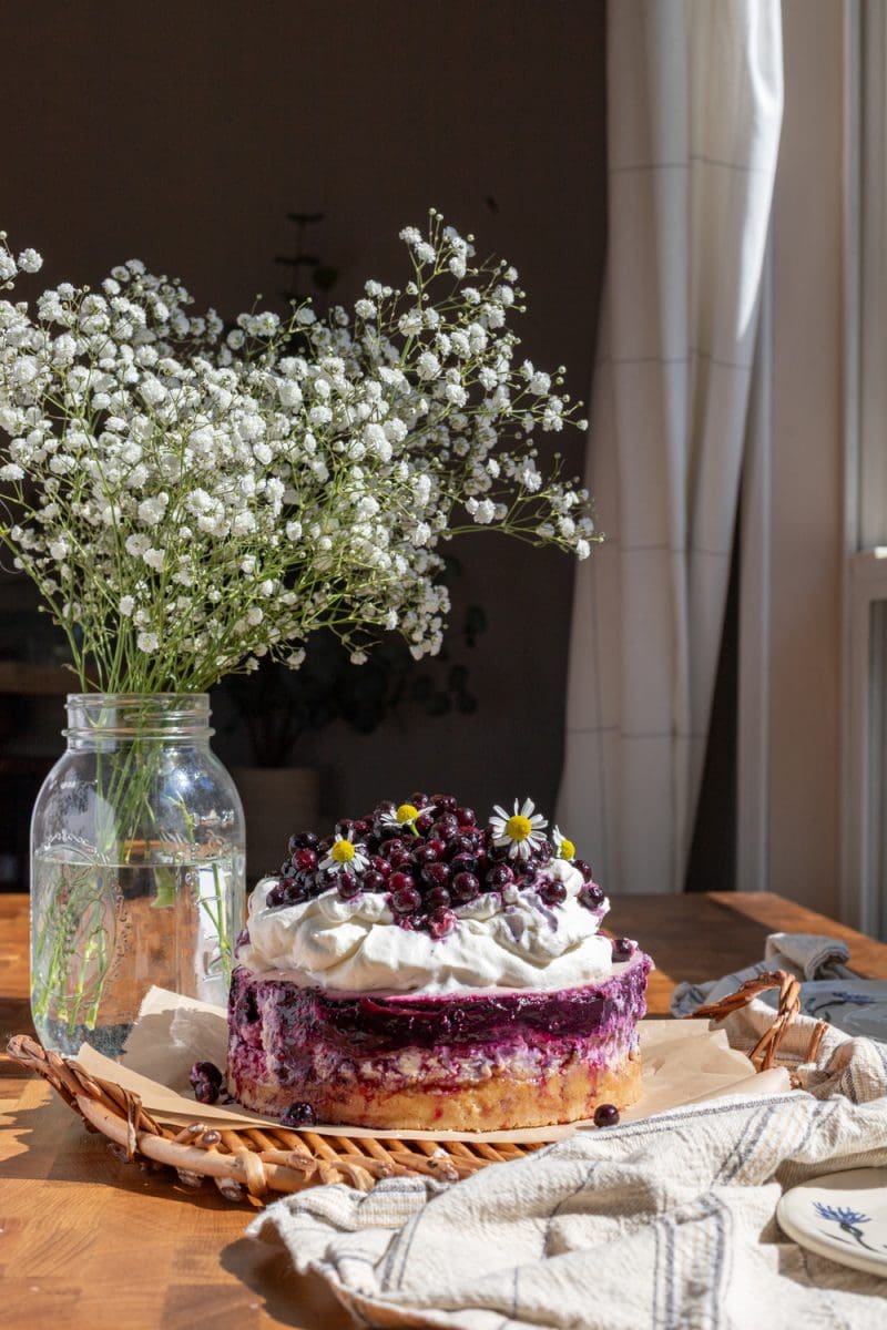 The wild blueberry cheesecake on a serving tray.