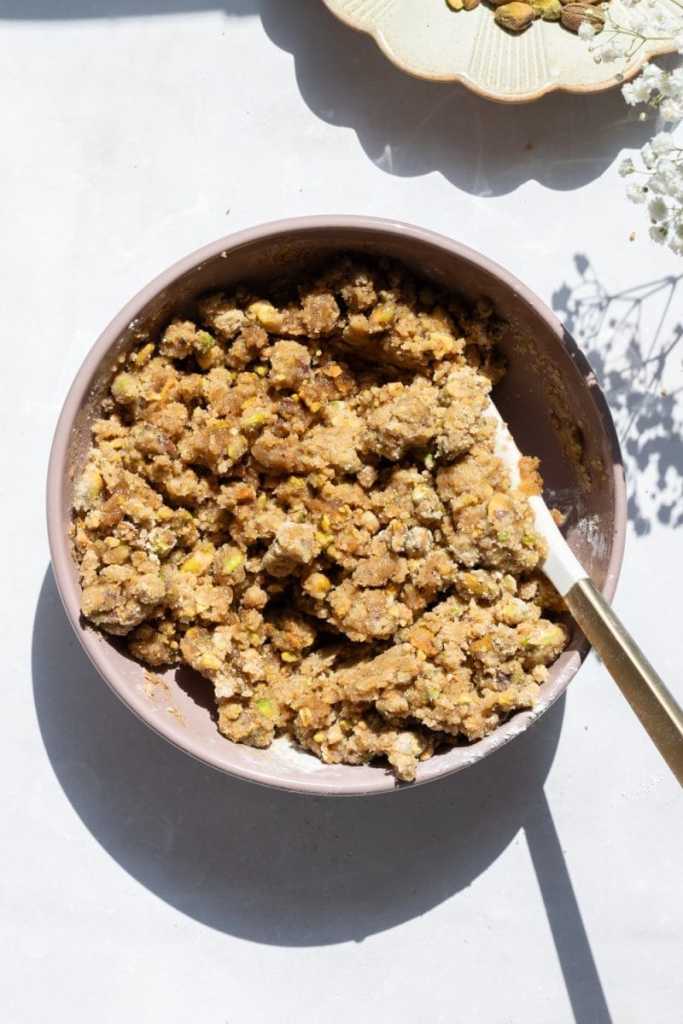 The pistachio streusel in a mixing bowl.