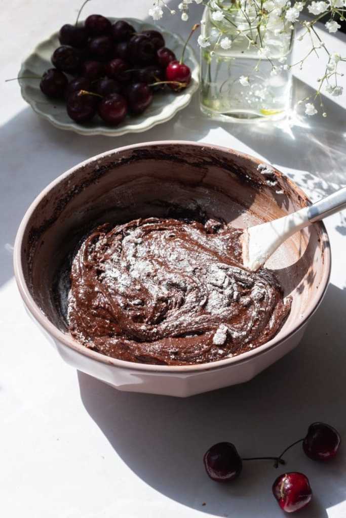 The mixing bowl with the flour folded in until only a few streaks of flour remain.
