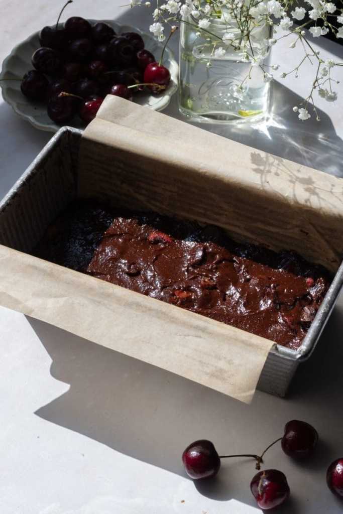 The brownie batter poured into a loaf pan.