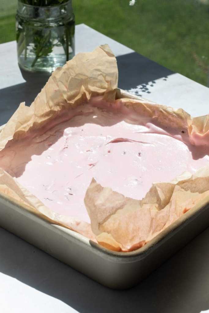 The cherry ice cream in a square pan.