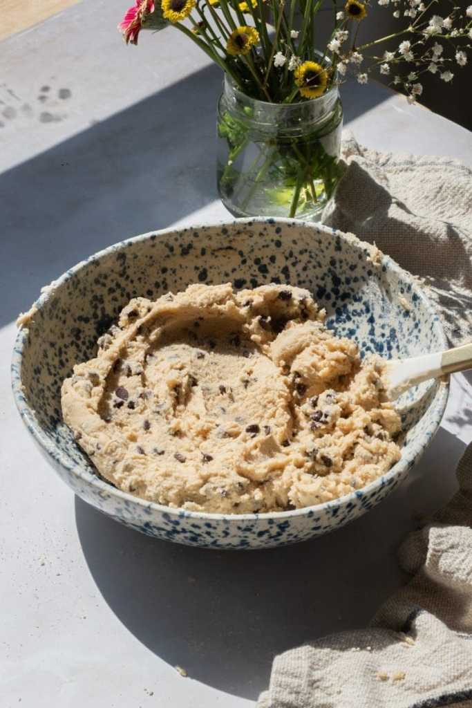 The edible cookie dough in a mixing bowl.