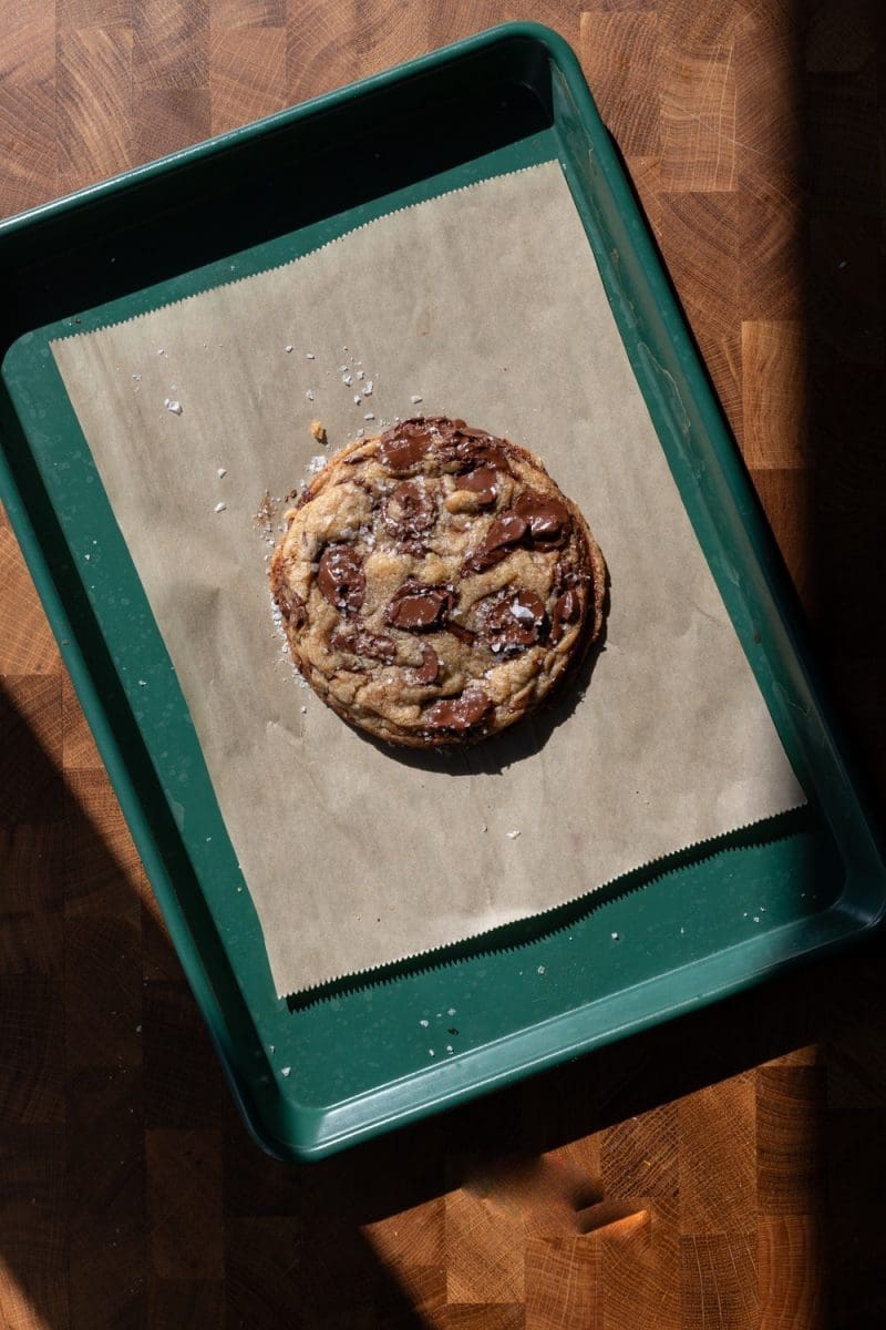 The single serve chocolate chip cookie on a baking tray.