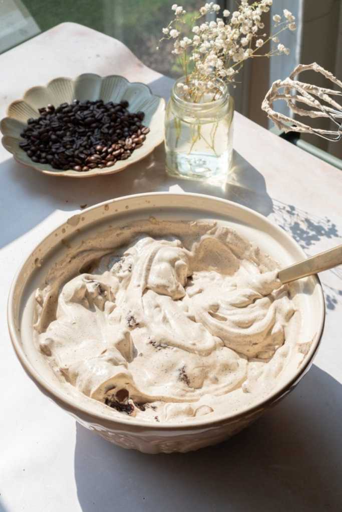 The no-churn coffee ice cream in a mixing bowl.