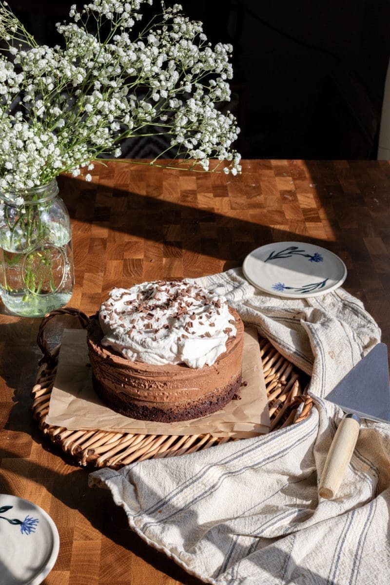 The french silk chocolate cake on a serving tray.